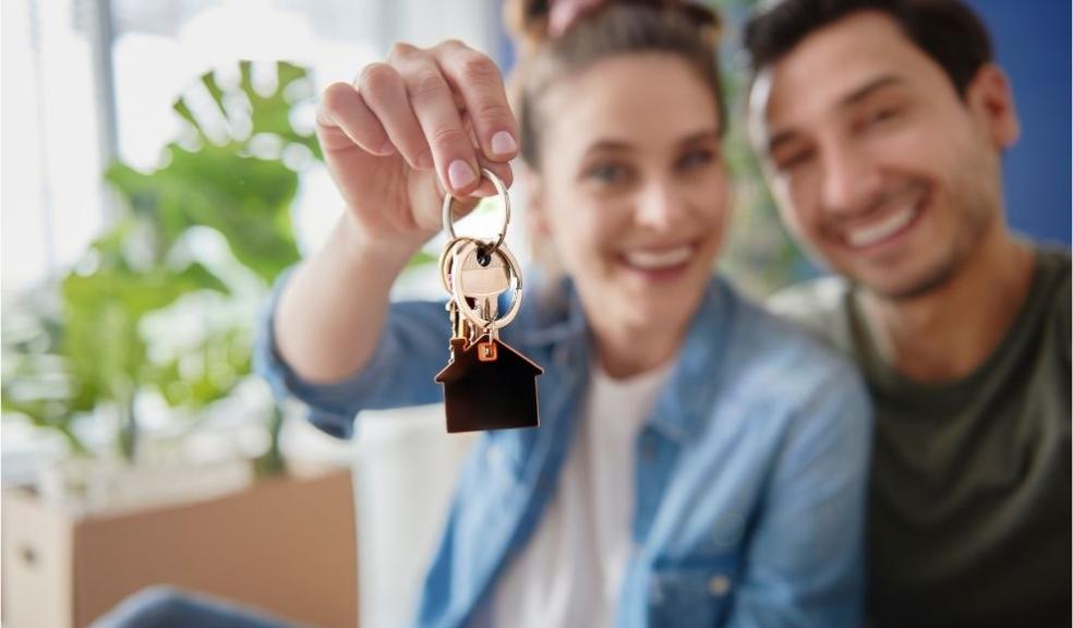 Young Couple with Keys of their New House