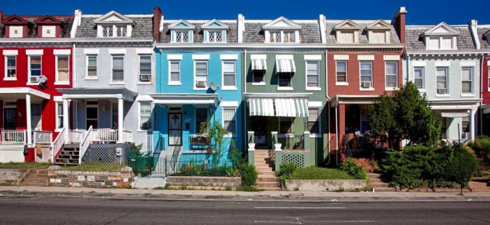 Couples are choosing to leave buying houses until after weddings row of colourful houses