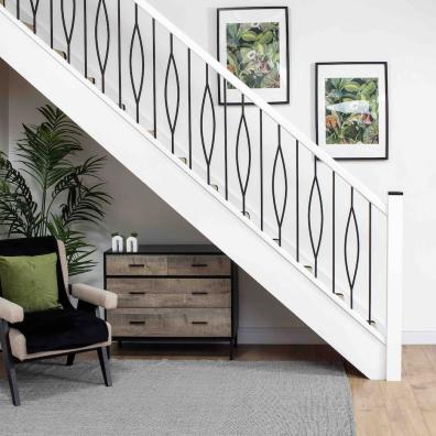 White staircase with black metal spindles